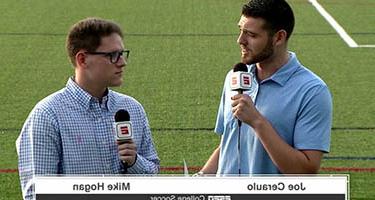 Two students on the soccer field doing a live broadcast for ESPN+ 